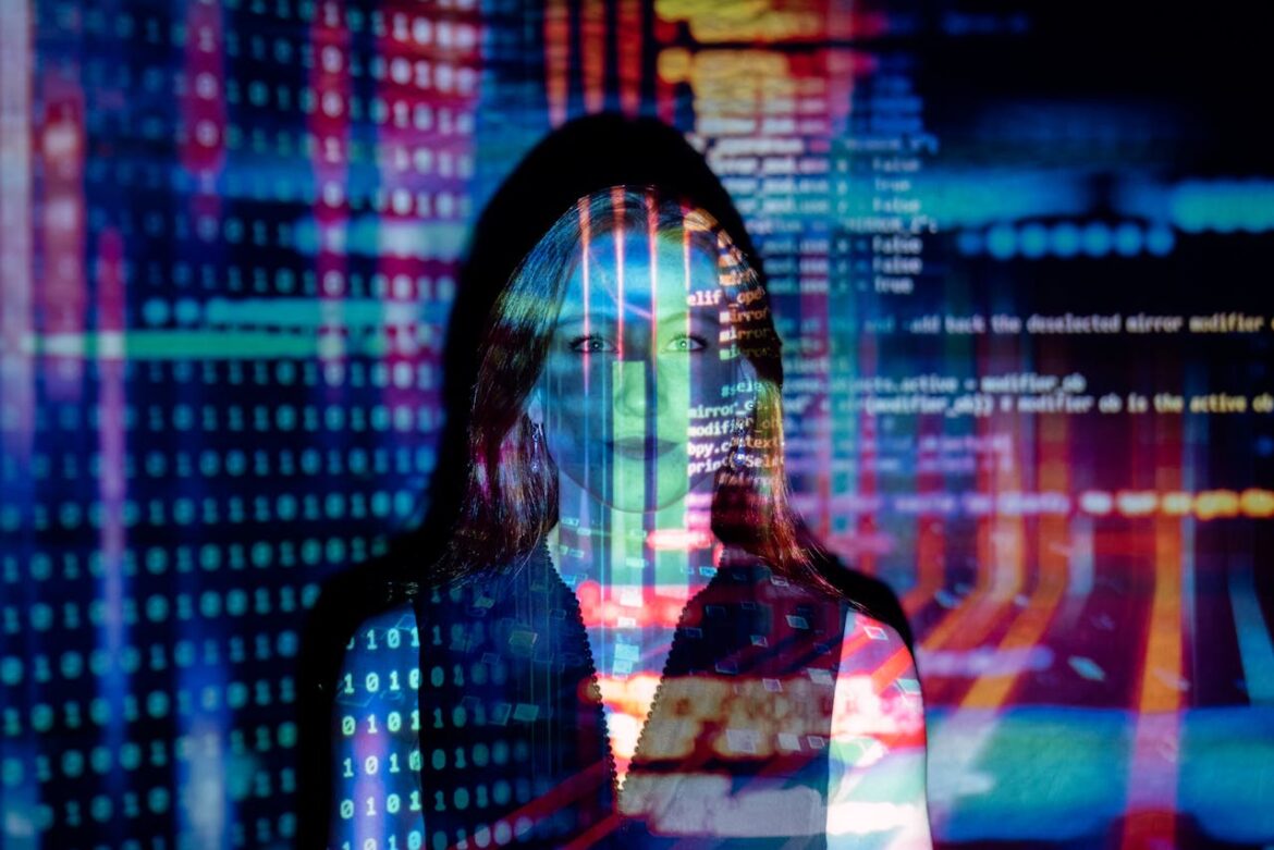 Woman standing in front of a projected image of data.